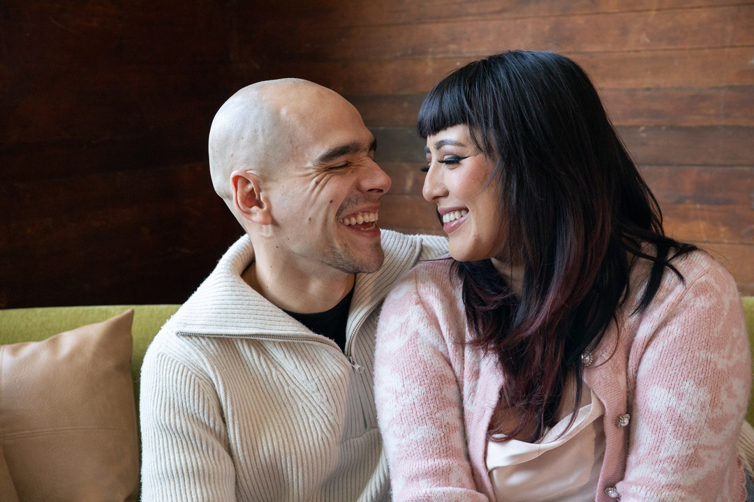 couple smiling wide with each other